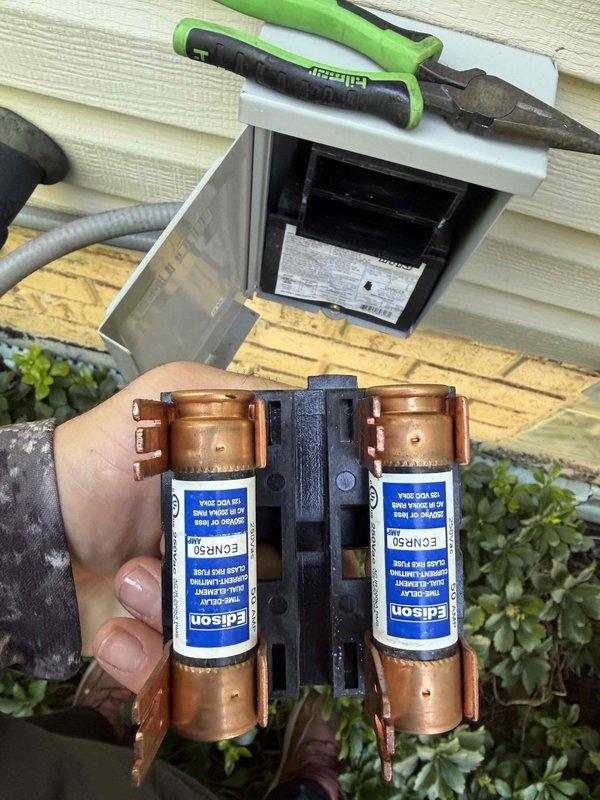 Completed cooling maintenance on air handler unit as part of club membership service. Performed electrical diagnostics using clamp meter, recording amperage draw of 0.96A and voltage reading of 0.2V to verify proper system operation. Inspected and serviced fuse assembly, removing Edison-brand fuses from exterior disconnect for testing and evaluation. All electrical components checked for proper function and safety compliance.