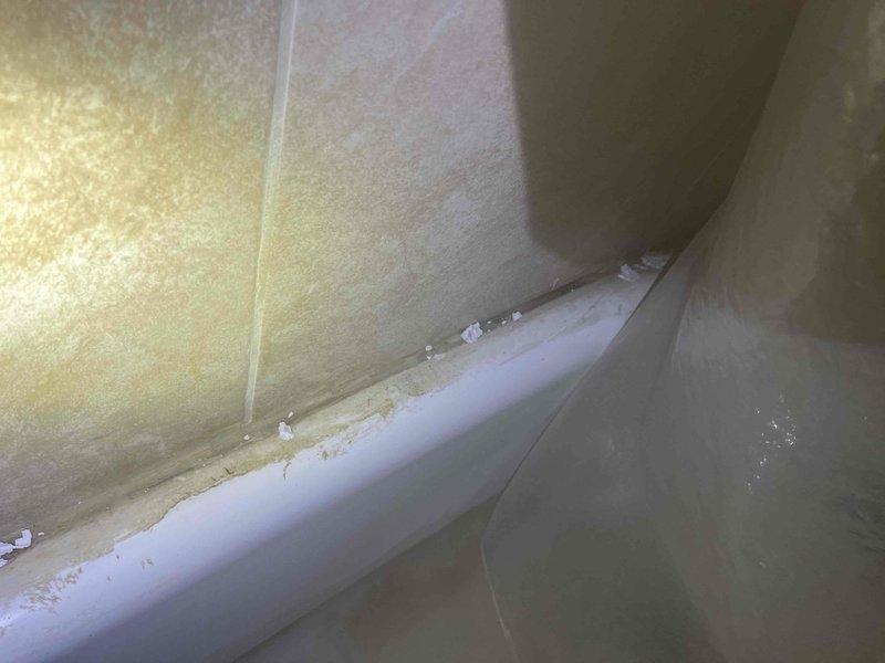 Responded to service call for bathtub drainage issue. Upon investigation, accessed drain assembly through floor access panel and inspected drainage system components including PVC drain line and associated plumbing connections. Diagnosed obstruction preventing proper drainage from tub. Cleared blockage and verified proper water flow through drain system. Also provided estimate for toilet resetting and sink repair work as requested.