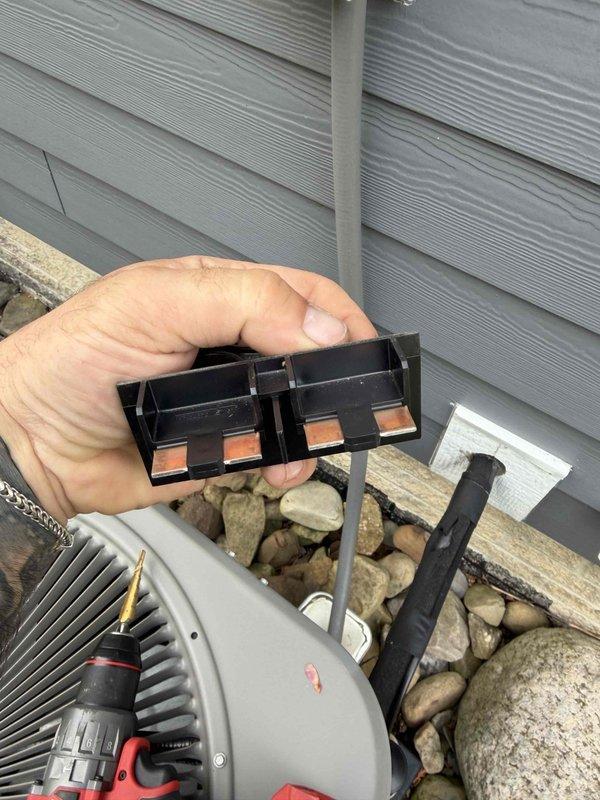 Performed routine air conditioning tune-up on residential system. Inspected outdoor condenser unit, electrical connections, and disconnect box, verifying all components were functioning properly and system was operating within normal parameters.