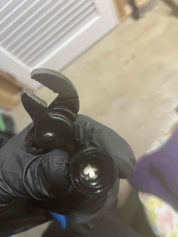 Responded to service call for odor issues in water supply caused by depleted chlorine injection system. Customer had already refilled the chlorine holding tank prior to arrival. Inspected existing water treatment system consisting of pressure tank, dual filtration tanks with digital controls, brine tank, and inline filter housing. Verified chlorine feed equipment was operational following tank refill and confirmed proper system function to restore water quality.
