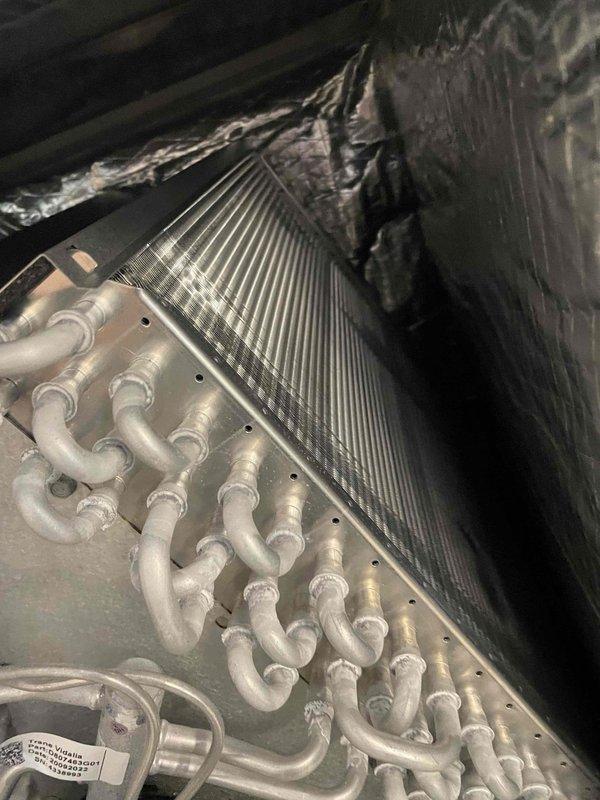 Completed cooling maintenance member visit on HVAC system. Performed standard inspection and documented system condition with photos showing clean pleated air filter properly installed in horizontal position and evaporator coil assembly with aluminum fins and refrigerant lines in functional condition. Customer requested soft start installation on one system for future service.