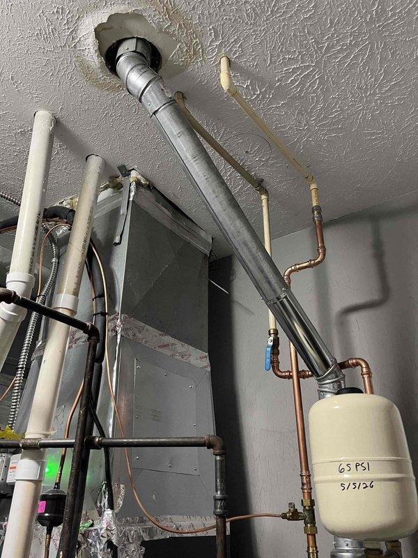 Responded to no hot water complaint on 50-gallon natural draft gas water heater, approximately 3-4 years old. Diagnosed failed heating element and replaced with new component. Verified proper operation of gas control valve, thermocouple, and pilot assembly. Tested hot water delivery at fixtures throughout home and confirmed full restoration of service. Inspected expansion tank pressure rating and plumbing connections, all found secure and functioning properly.