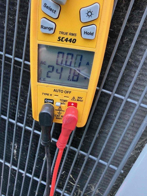 Completed comprehensive tune-up on 11-year-old Lennox air conditioning system. Performed electrical diagnostics using digital multimeter, measuring amperage draw at 0.46A and verifying control voltage at 24.10V AC to ensure proper system operation. All readings within manufacturer specifications, and unit operating efficiently despite previous coil-related issues from earlier service history.