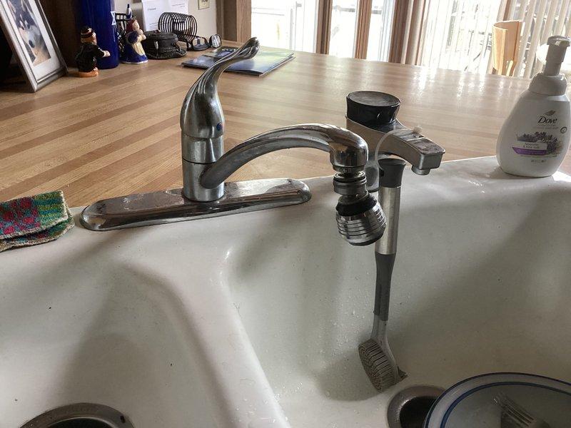 Completed club membership enrollment for plumbing maintenance services. Conducted comprehensive visual inspection of residential plumbing fixtures including bathroom toilet assembly and kitchen sink configuration with mounted water filtration system. Confirmed property does not have tankless water heater installation. Documented existing plumbing infrastructure with photographic records for service file.