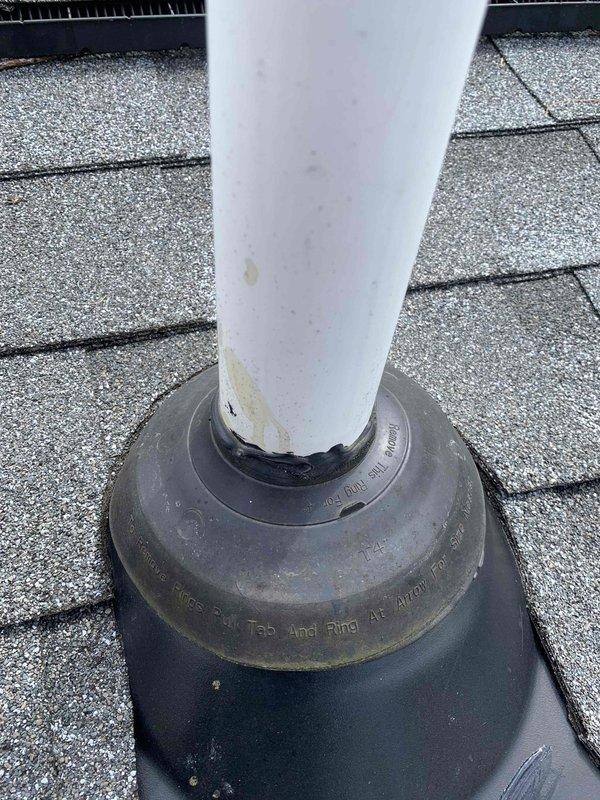 Responded to callback following recent fresh air intake installation after heavy rainfall. Inspected PVC intake pipe installation running through attic space and roof penetration. Verified proper mounting and securing of intake pipe to roof framing members with appropriate brackets and straps. Examined rubber boot flashing at roof penetration point for proper seal and water intrusion. Confirmed all components properly installed with no leaks or water damage to system despite torrential rain conditions.