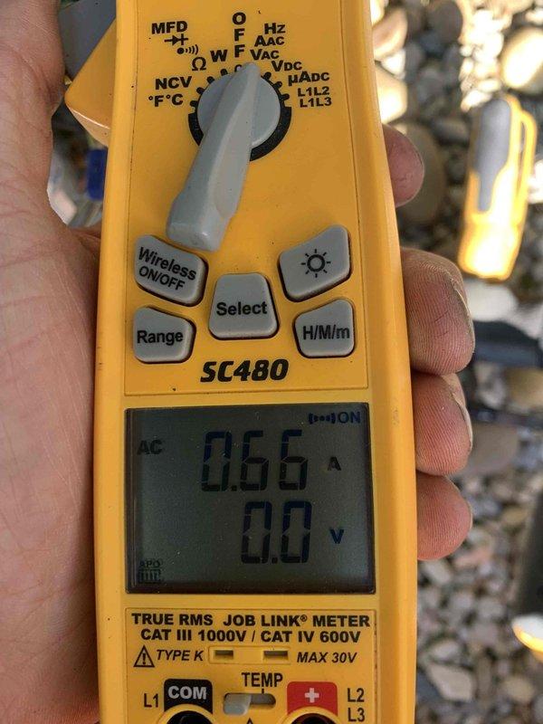 Completed routine cooling maintenance and system diagnostics on residential HVAC unit. Performed electrical testing using digital multimeter, recording 0.66 AC voltage readings to verify proper system operation and component functionality. All equipment inspected and found operating within normal parameters.