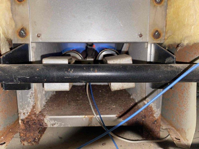 Returned to property to install new 5" vent damper on boiler system and complete boiler maintenance plan service. Installed vent damper assembly on flue pipe, verified proper operation and electrical connections reading 102.9 on meter diagnostics. Performed comprehensive boiler maintenance including burner inspection, cleaned burner assembly compartment which showed signs of rust and corrosion, checked all safety controls and wiring connections, and confirmed system operational parameters within manufacturer specifications.
