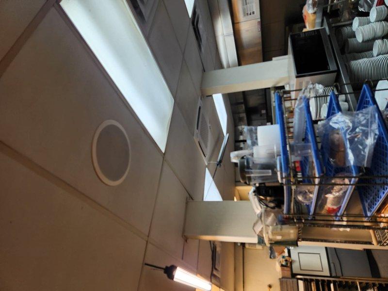 Completed mini split installation in commercial facility dining area. Installed indoor wall-mounted air handler unit with proper mounting, refrigerant line set connections, condensate drainage, and electrical wiring. System tested and confirmed operational with proper airflow and temperature control.