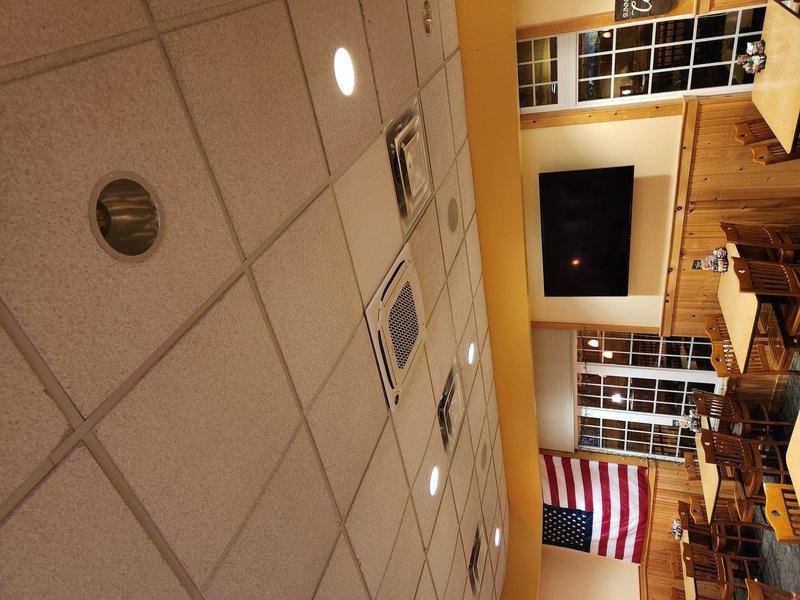 Completed mini split installation in commercial facility dining area. Installed indoor wall-mounted air handler unit with proper mounting, refrigerant line set connections, condensate drainage, and electrical wiring. System tested and confirmed operational with proper airflow and temperature control.