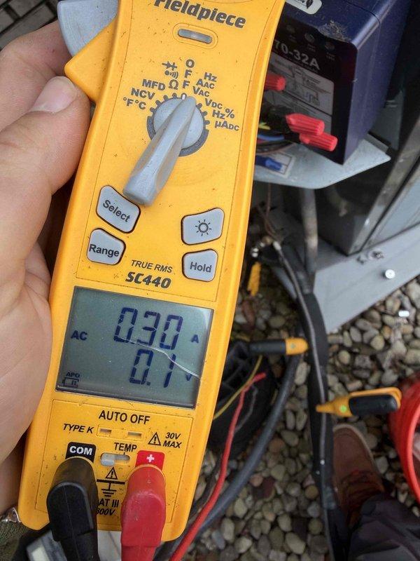 Completed cooling maintenance club visit on air handler system. Performed electrical diagnostics using digital multimeter to verify proper voltage and capacitance readings, inspected and tested dual fuse disconnect assembly with Edison-type fuses, confirmed all electrical connections were secure and within manufacturer specifications, and documented equipment condition with photos for service records.
