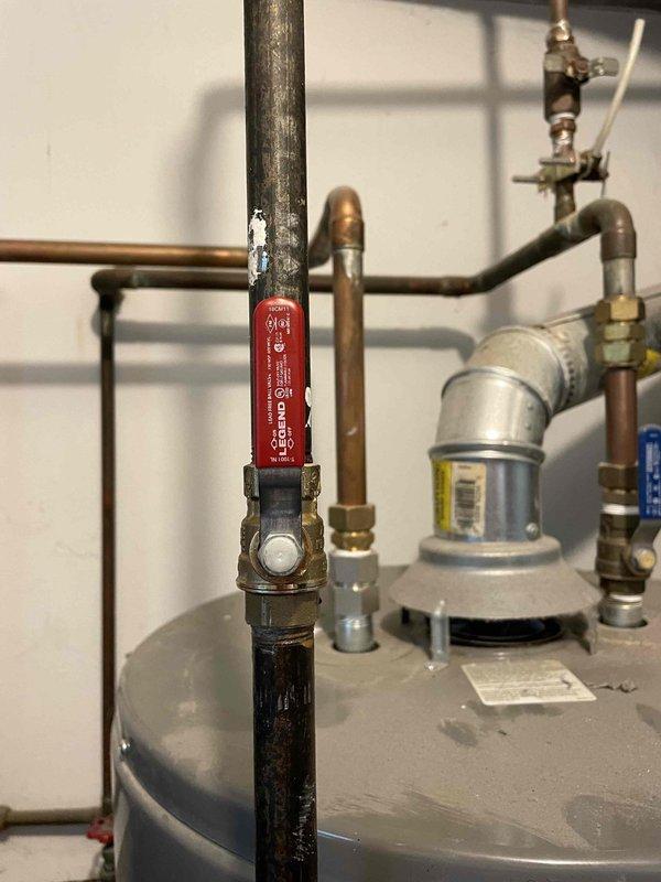 Responded to gas leak on water heater system. Located and identified leaking gas fitting on supply line with faint odor present. Removed defective brass fitting from gas pipe connection and replaced with new component. Tested all connections for leaks using approved detection methods and confirmed system integrity. Verified proper operation of temperature and pressure relief valve and surrounding plumbing components before restoring gas service to unit.