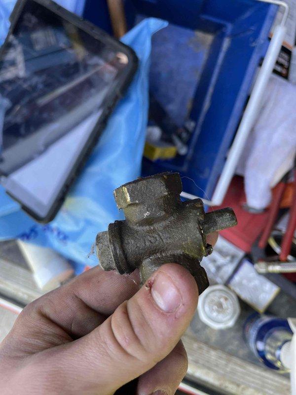 Responded to gas leak on water heater system. Located and identified leaking gas fitting on supply line with faint odor present. Removed defective brass fitting from gas pipe connection and replaced with new component. Tested all connections for leaks using approved detection methods and confirmed system integrity. Verified proper operation of temperature and pressure relief valve and surrounding plumbing components before restoring gas service to unit.