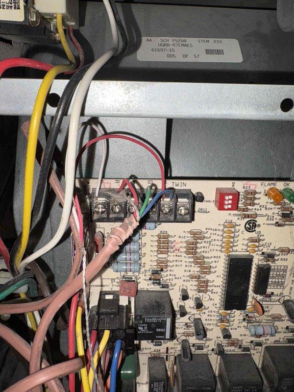 Completed furnace estimate for system replacement. Inspected existing furnace control board and identified electronic components, wiring connections, and operational indicators. Evaluated attic installation area including existing ductwork, PVC condensate drainage system, and available space for new equipment placement within the structural framing.