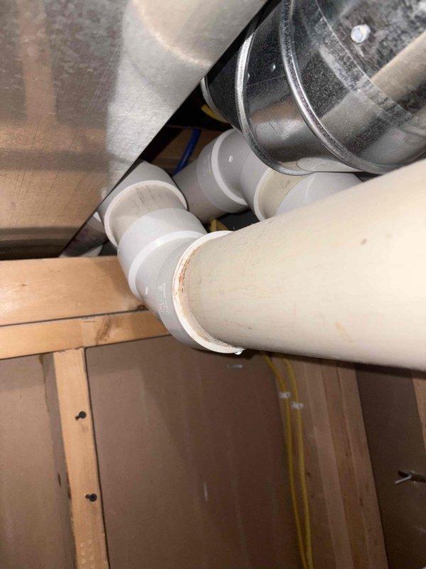 Completed furnace estimate for system replacement. Inspected existing furnace control board and identified electronic components, wiring connections, and operational indicators. Evaluated attic installation area including existing ductwork, PVC condensate drainage system, and available space for new equipment placement within the structural framing.