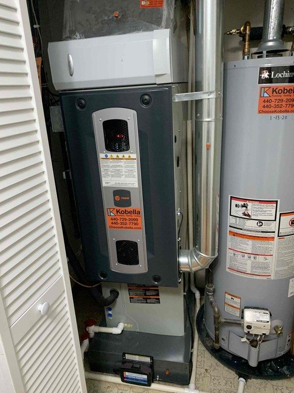 Completed cooling maintenance on two air handlers per club membership agreement. Performed comprehensive system inspection including electrical testing with digital multimeter, confirming voltage readings at 234.6V within acceptable parameters. Inspected wall-mounted HVAC unit and associated water heating equipment, verifying proper operation of digital controls and system components. Documented equipment condition through photographs for service records. All systems operating within normal specifications upon completion of maintenance visit.