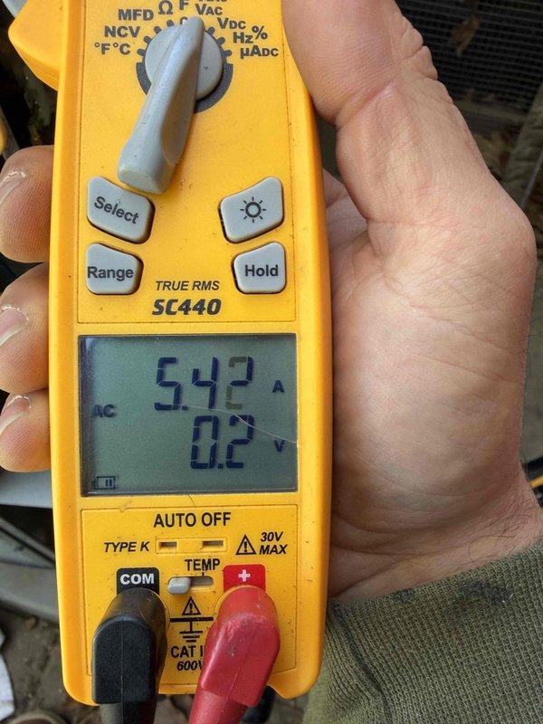 Completed cooling maintenance club visit on air handler system. Performed electrical diagnostics using digital multimeter, measuring amperage draw at 54.2A and verifying voltage readings at 5.05V. Inspected and tested capacitor connections, confirming proper wire terminations and electrical continuity throughout the system to ensure optimal performance.
