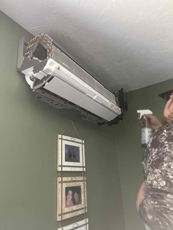 Performed comprehensive refrigerant leak detection on ductless mini-split system by pressurizing system to 50 PSI and applying leak detection solution to all connections, indoor unit, and outdoor unit components. Extended pressure test conducted to verify system integrity, with particular attention to copper line connections and evaporator assembly where cover was removed for thorough inspection.
