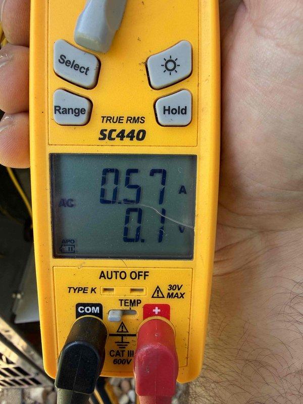Completed prepaid club maintenance visit on air handler unit. Performed electrical diagnostics using multimeter, measuring amperage draw at 0.57A and testing capacitor which read 4.987μF. Verified proper electrical operation and documented system performance with diagnostic readings.