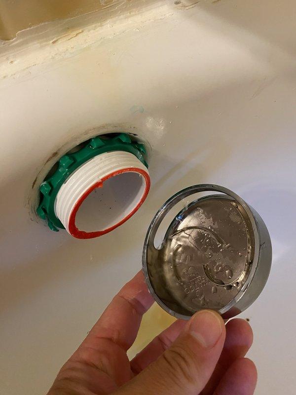 Responded to callback for bathtub overflow assembly with deteriorating caulking. Removed and replaced overflow cover plate, installed new rubber gasket and plumber's putty around drain fitting to ensure proper seal. Verified water-tight connection and inspected under-floor plumbing assembly including PEX supply lines and shut-off valves for any related leaks or issues.