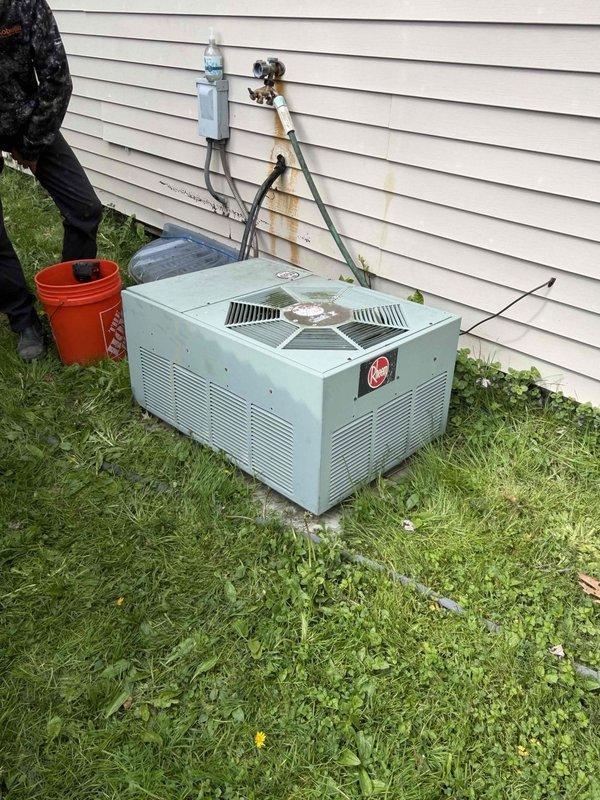 Completed routine HVAC maintenance club visit on residential air conditioning system. Performed comprehensive inspection of outdoor condensing unit, noting weathered copper refrigerant lines with age-appropriate discoloration, and examined indoor blower assembly which showed moderate dust accumulation on squirrel cage fan wheel and motor housing. System operational at time of inspection with standard cleaning and preventive maintenance protocols applied to ensure continued efficient performance.