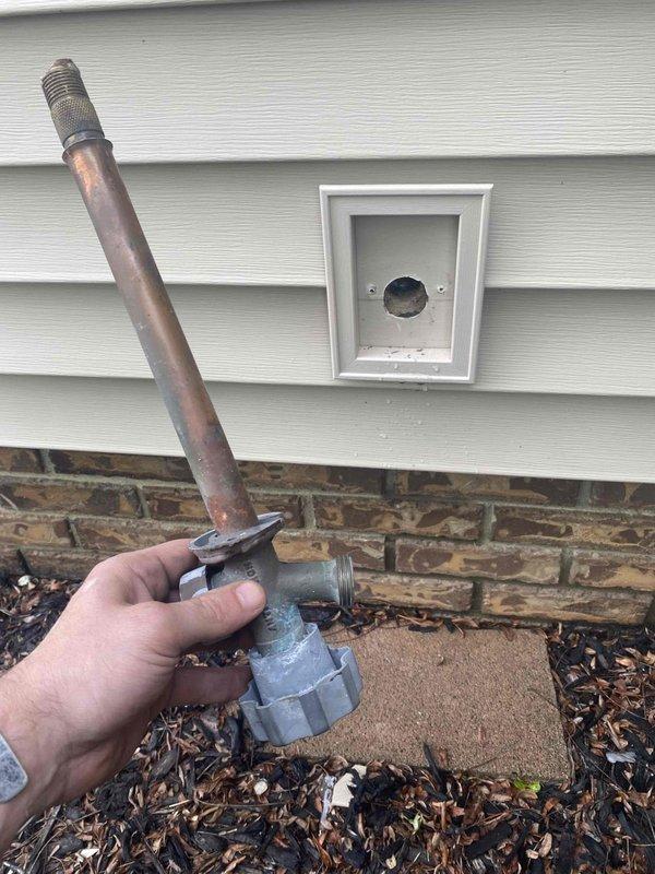 Completed outdoor spigot replacement on 36-year-old residential property. Removed deteriorated existing hose bib showing significant corrosion and oxidation, then installed new copper piping with shutoff valve in crawlspace area. Secured copper lines between floor joists using proper supports and connected new frost-free sillcock through exterior wall penetration above brick foundation. Tested system for proper operation and verified no leaks at connections. Old corroded fixture removed and disposed of properly.
