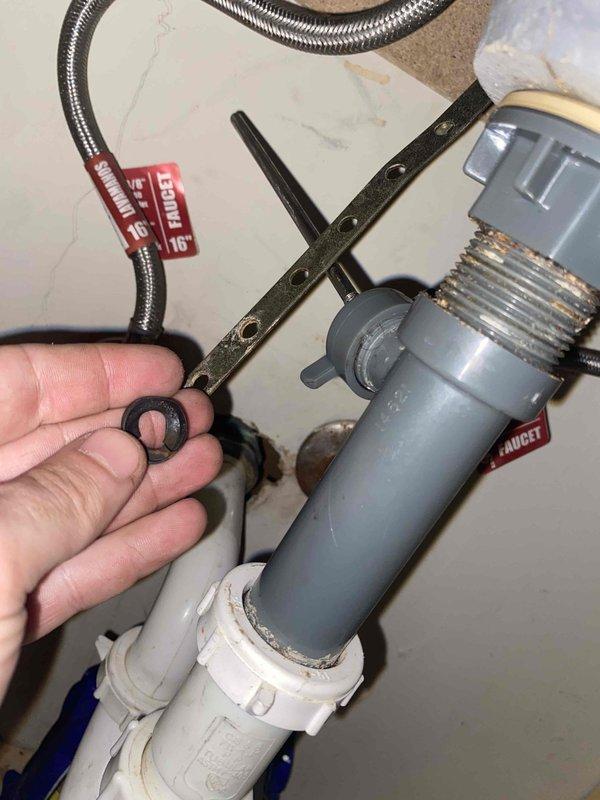 Responded to service call for multiple clogged drains including bathroom tub and sink, plus kitchen sink. Bathroom tub blockage was caused by hair accumulation. Removed and inspected P-trap assembly under sink, replaced worn O-ring seal on drain connections. Cleared debris from affected drains and verified proper water flow through all fixtures. All drainage systems restored to normal operation.