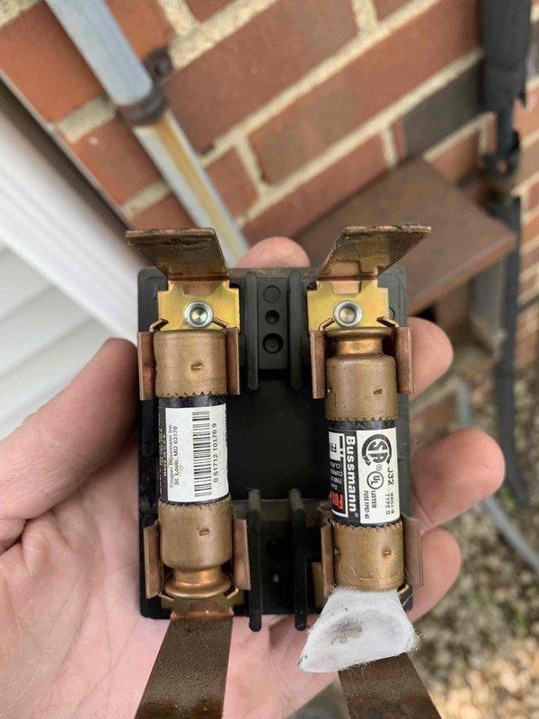 Completed cooling maintenance club visit on air handler system. Inspected and tested electrical components including dual cartridge fuses in outdoor disconnect, verifying proper amperage ratings and secure connections. Measured system temperature differential using digital multimeter, recording 22.1°F temperature split across evaporator coil, indicating adequate cooling performance and proper refrigerant charge.