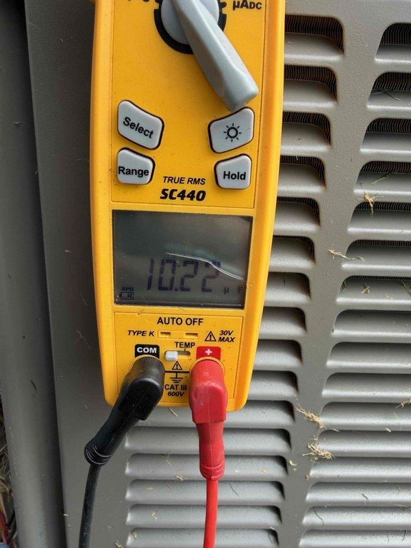 Completed scheduled cooling maintenance member visit on HVAC system. Performed diagnostic measurements using digital multimeter, recording voltage reading of 249.4V AC and amperage draw of 10.22A to verify proper electrical operation and system performance. Unit operating within normal parameters with no issues identified during inspection.