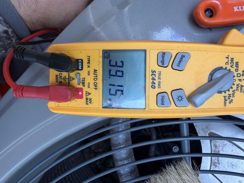 Completed preventative maintenance tune-up on 6-year-old air conditioning system per customer request. Performed comprehensive system inspection, verified electrical connections at service disconnect, and measured operating amperage at 39.5 amps using clamp meter to confirm unit is running within normal parameters. System found to be operating properly with no issues identified.