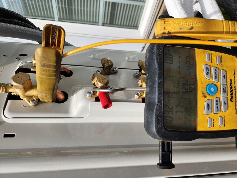 Returned to property to perform system start-up on recently installed mini-split system and collect final payment. Connected Fieldpiece digital manifold gauges to service ports and verified refrigerant pressures and system temperatures were within manufacturer specifications. Measured supply and return air temperatures using digital thermometer to confirm proper system operation and cooling capacity. All diagnostic readings indicated system was functioning correctly with appropriate temperature differential across the indoor unit. Start-up procedure completed successfully with equipment operating as designed.