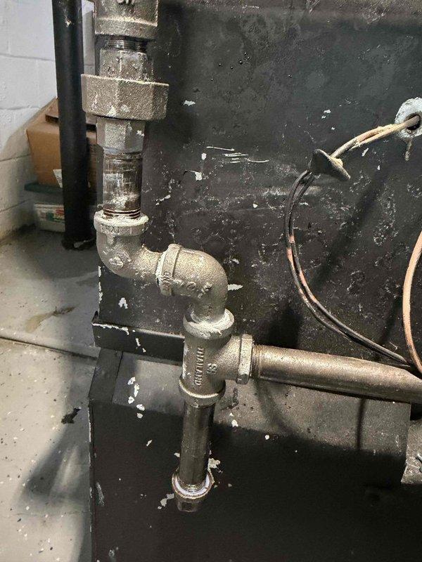 Responded to gas leak service call on furnace system that had been previously shut off for safety. Gas utility company had identified two leaks at a pipe junction point. Upon arrival, conducted thorough inspection of the furnace piping system and gas line connections in the mechanical room. Located the reported leak points at the threaded pipe fittings and junction connections. Performed leak detection testing to confirm exact leak locations. Disassembled affected pipe joints, applied new pipe thread sealant, and reassembled connections to manufacturer specifications. Tightened all fittings to proper torque. Conducted pressure test and soap bubble test on all repaired joints to verify leak elimination. Restored gas supply and verified system integrity before returning furnace to operational status.