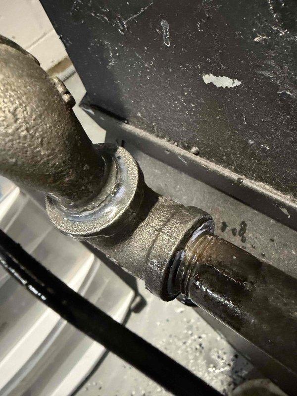 Responded to gas leak service call on furnace system that had been previously shut off for safety. Gas utility company had identified two leaks at a pipe junction point. Upon arrival, conducted thorough inspection of the furnace piping system and gas line connections in the mechanical room. Located the reported leak points at the threaded pipe fittings and junction connections. Performed leak detection testing to confirm exact leak locations. Disassembled affected pipe joints, applied new pipe thread sealant, and reassembled connections to manufacturer specifications. Tightened all fittings to proper torque. Conducted pressure test and soap bubble test on all repaired joints to verify leak elimination. Restored gas supply and verified system integrity before returning furnace to operational status.