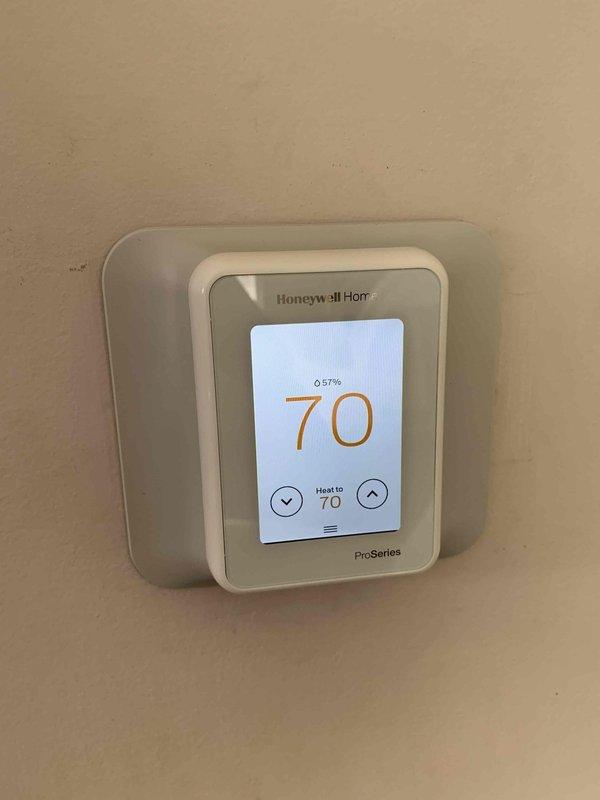 Responded to service call for air conditioning unit that would not shut off. Diagnosed faulty thermostat control board causing continuous operation. Replaced Honeywell Home ProSeries thermostat and verified proper cycling of HVAC system with Emerson control board. Unit now operating correctly with proper temperature control and automatic shut-off functionality.