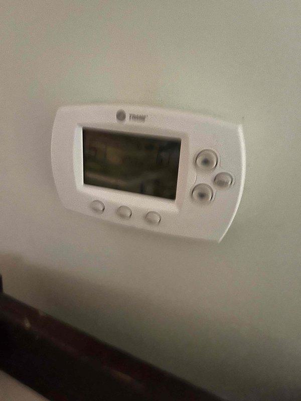Converted lead to maintenance agreement enrollment. Documented existing HVAC system including programmable thermostat and basement mechanical equipment with humidifier attached to ductwork. Captured system condition and setup for service records.