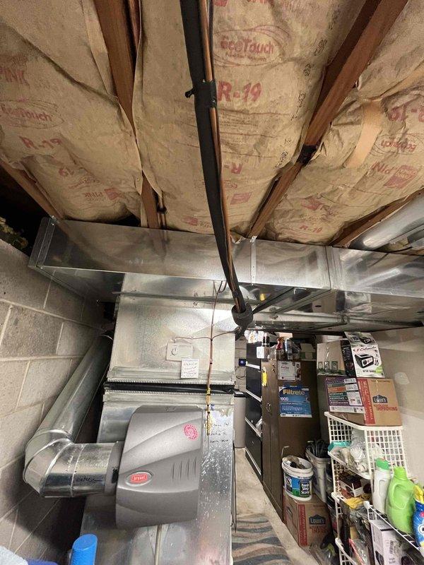 Converted lead to maintenance agreement enrollment. Documented existing HVAC system including programmable thermostat and basement mechanical equipment with humidifier attached to ductwork. Captured system condition and setup for service records.
