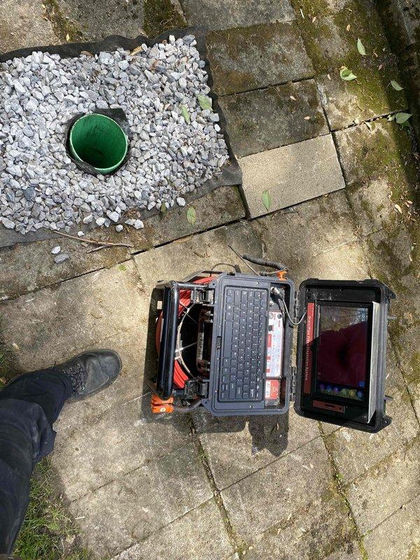 Performed video inspection of main sewer line through backyard cleanout to diagnose reported drainage issues. Camera inspection revealed significant debris and sediment buildup within the pipe at approximately 23 feet from access point. Confirmed previous assessment that the sewer line requires hydro jetting service to restore proper flow and remove accumulated blockage material.