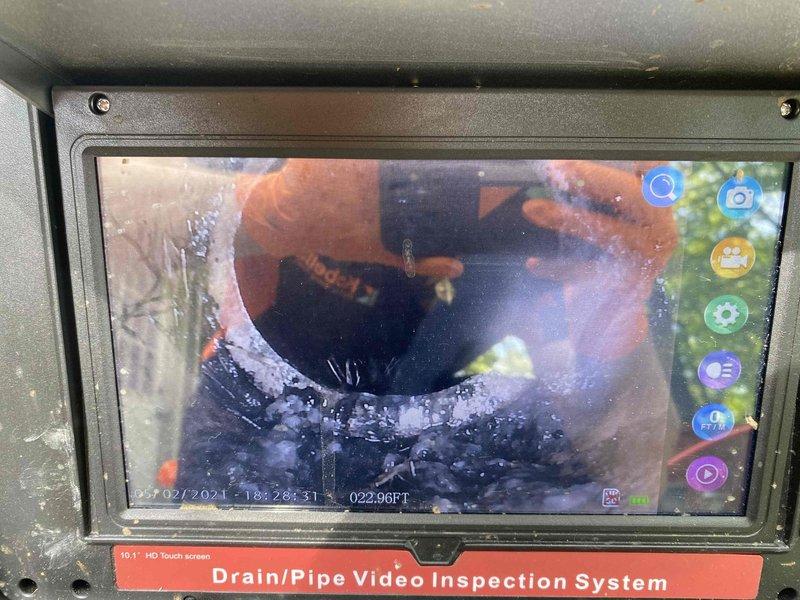 Performed video inspection of main sewer line through backyard cleanout to diagnose reported drainage issues. Camera inspection revealed significant debris and sediment buildup within the pipe at approximately 23 feet from access point. Confirmed previous assessment that the sewer line requires hydro jetting service to restore proper flow and remove accumulated blockage material.