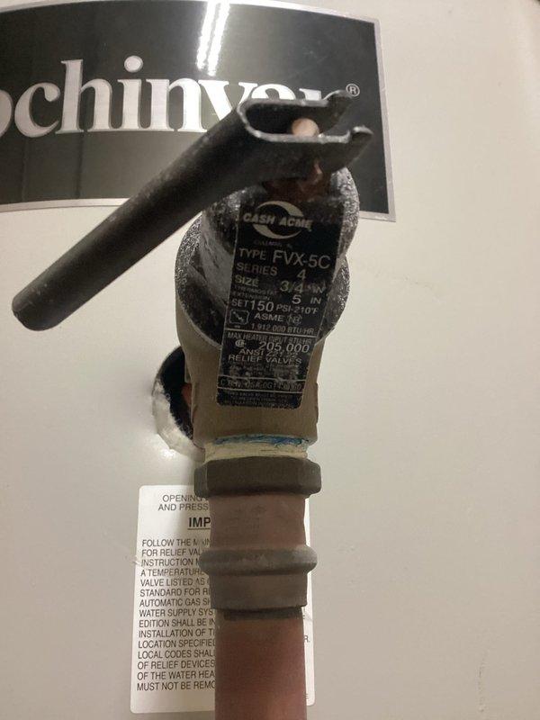 Responded to commercial boiler service call and performed system inspection. Documented pressure relief valve assembly (Cash Acme Type FVX-5C, 3/4", rated 150 PSI at 210°F, 203,000 BTU/H capacity) and gas valve regulator (70,000 BTU/HR capacity) showing signs of age with mineral deposits and surface oxidation on copper piping connections. All components operational and within specifications at time of inspection.