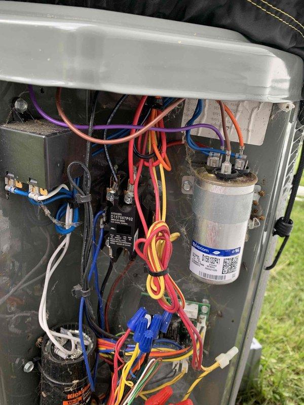 Completed routine HVAC club maintenance visit on outdoor condensing unit. Performed system inspection, documenting interior electrical components including capacitor, wiring connections, and control board, all found to be in functional condition with normal wear patterns. Replaced heavily soiled pleated air filter that had reached maximum dirt loading capacity, restoring proper airflow to the system.