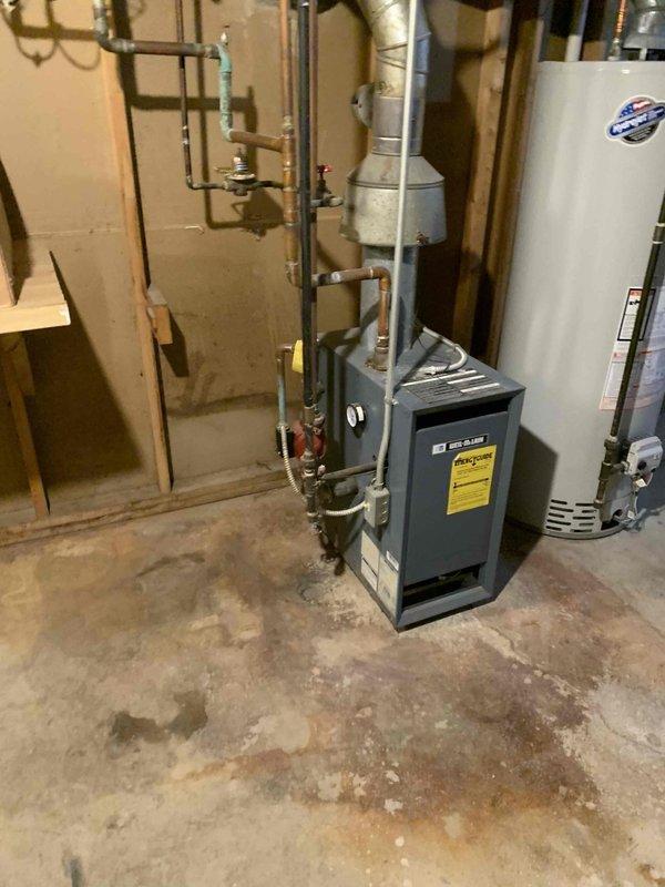 Responded to no cooling call on 30-year-old residential HVAC system. Upon arrival, accessed air handler through ceiling panel and inspected basement mechanical equipment including furnace and associated ductwork. Documented existing system configuration and condition. Advised customer that due to advanced age of equipment, repair options would be limited and replacement should be considered for long-term reliability.