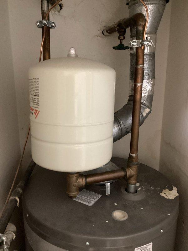 Completed club membership renewal and plumbing maintenance visit. Addressed slow drainage issues in both kitchen and bathroom sinks. Inspected bathroom vanity with undermount sink and chrome pop-up drain assembly, along with water heating system components including expansion tank and copper supply lines. All plumbing fixtures and connections evaluated for proper operation and drainage performance.