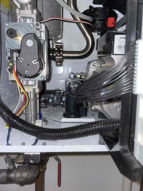 Returned to property to complete check valve replacement on Navien tankless water heater system. Parts had been ordered and received via next-day air delivery. Successfully removed failed check valve assembly from the unit and installed new replacement component, ensuring proper orientation and secure connections to the gas valve assembly and associated piping. Verified all mechanical connections were tight and leak-free, tested system operation to confirm proper function of the new check valve, and ensured unit returned to normal operating parameters.
