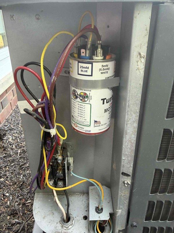 Completed routine cooling maintenance member visit on residential HVAC system. Performed comprehensive inspection of outdoor condensing unit, including examination of dual-run capacitor showing 25 MFD and 5 MFD ratings with proper terminal connections. Verified electrical connections and wire routing throughout unit, with all colored leads properly secured to capacitor terminals. Utilized Fieldpiece SC440 clamp meter to measure system amperage, recording reading of 485.6 during diagnostic testing. Inspected internal components within access panel, confirming all wiring connections remain tight and secure with no signs of deterioration. Unit operating within normal parameters with no immediate service needs identified.