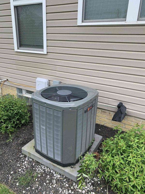 Completed cooling maintenance club visit on residential air conditioning system. Performed comprehensive inspection of outdoor condenser unit and indoor thermostat controls. Condenser unit found in good operating condition with proper placement on concrete pad and adequate clearance from surrounding landscaping. Verified Honeywell ProSeries thermostat functioning correctly with system maintaining 72°F setpoint in auto fan mode. All components operating within normal parameters with no issues identified requiring immediate attention.