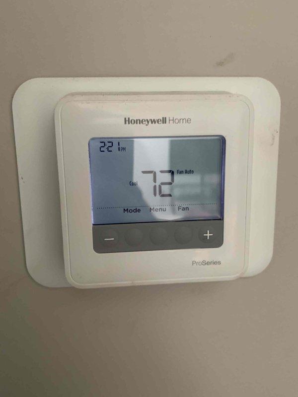 Completed cooling maintenance club visit on residential air conditioning system. Performed comprehensive inspection of outdoor condenser unit and indoor thermostat controls. Condenser unit found in good operating condition with proper placement on concrete pad and adequate clearance from surrounding landscaping. Verified Honeywell ProSeries thermostat functioning correctly with system maintaining 72°F setpoint in auto fan mode. All components operating within normal parameters with no issues identified requiring immediate attention.