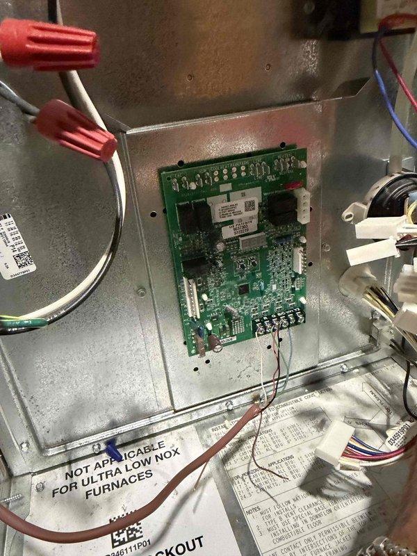 Replaced defective furnace control board under manufacturer parts and labor warranty. Removed failed DD1003 control board from furnace control panel, disconnected all low-voltage wiring from terminal block and high-voltage connections from gas valve assembly. Installed new OEM control board, reconnected all wiring harnesses to proper terminals, and verified secure connections with wire nuts. Tested system operation to confirm proper furnace ignition sequence and control functionality. Unit operating normally upon completion.