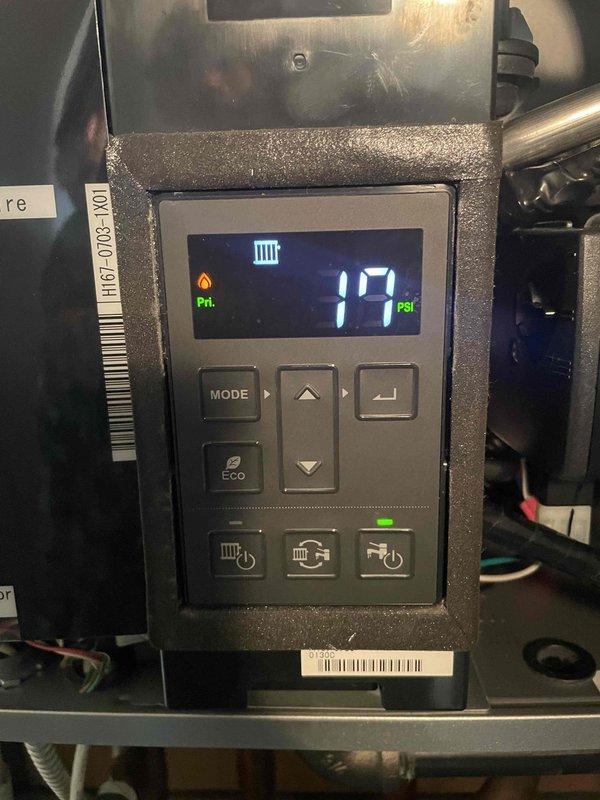 Returned to site to complete warranty work for previously sold part. Installed replacement control board assembly on heating system. Verified proper operation of digital display panel showing system pressure reading of 17 PSI. Confirmed all control functions including MODE, ECO, and power buttons operating correctly with indicator lights functioning as designed. Inspected pressure sensor connections and refrigerant line connections at manifold assembly. System tested and running within normal parameters upon completion.