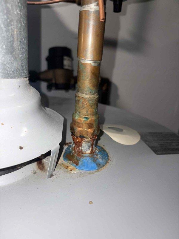 Responded to water leak service call and located pinhole leak in copper pipe within attic crawl space. Repaired compromised section of copper piping showing corrosion and oxidation, replaced deteriorated connection point with visible mineral deposits and rust accumulation, and verified system integrity upon completion.