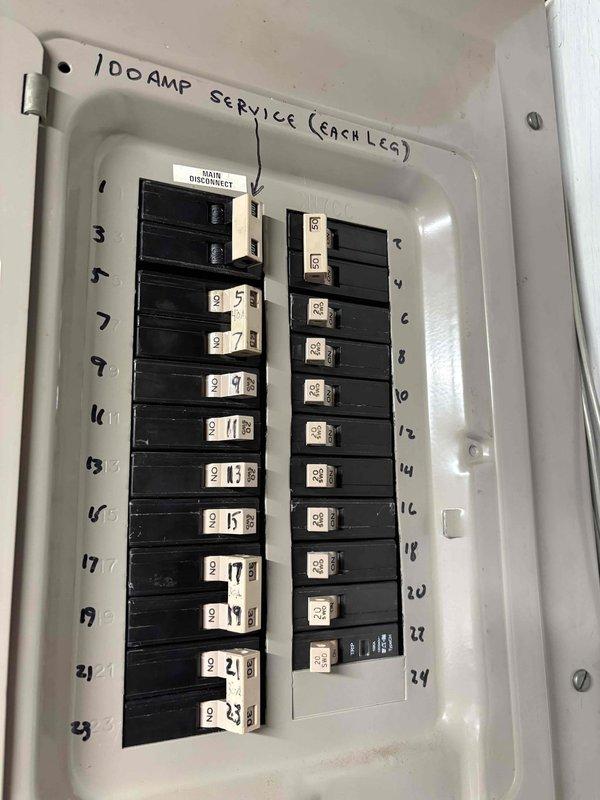 Disconnected residential air conditioning system to allow for waterproofing work on the air handler area. Upon completion of waterproofing, reconnected the AC unit and verified proper electrical connections at the 100-amp service panel to ensure safe system operation.