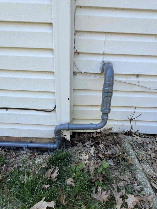 Completed follow-up visit to sand and paint gas line that was unable to be finished during previous fall service call. Prepared surface of exposed PVC gas piping running along building foundation, including vertical and horizontal sections with elbow fittings. Applied appropriate coating to protect piping system from weathering and UV exposure. Cleared debris and leaves from work area around foundation to ensure proper access and finish quality.